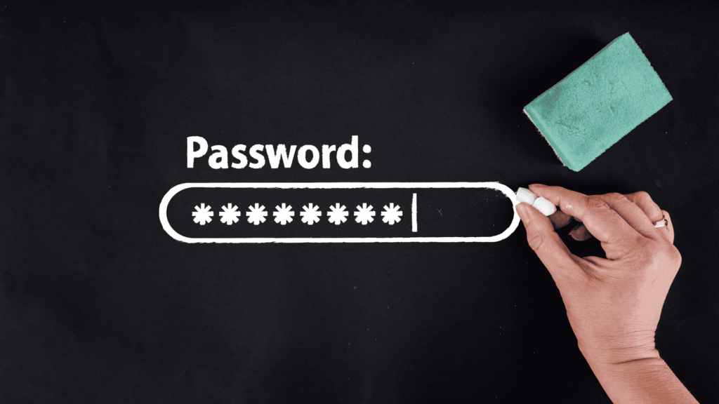 Blackboard with a hand holding a piece of chalk and a blackboard sponge, next to a password login box depicting changing your password.