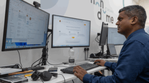 Photo of a member of the Iron Dome team at their workstation providing Managed IT support