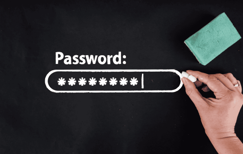 Blackboard with a hand holding a piece of chalk and a blackboard sponge, next to a password login box depicting changing your password.
