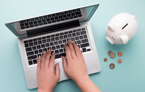 top-view-finance-elements-with-white-piggy-bank_23-2148783049